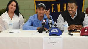 A grieving Tremont Waters carries