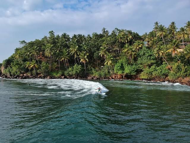 Midigama Lazy Left surf break reef longboard 100 metres south coast Sri Lanka budget guesthouses authentic surf village