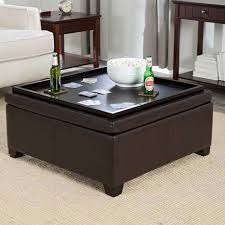 This stylish storage ottoman makes a great coffee table, provides extra seating and is a cushy place to prop up your feet at the end of the day. Antique Storage Ottomans Zab Living And Black Medium Coffee Table Ottoman Tray Wi Storage Ottoman Coffee Table Leather Ottoman Coffee Table Padded Coffee Table