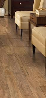 The Defined Graining And Unique Markings Of This Laminate Floor Give It An Authentic Rustic O Cheap Basement Remodel Basement Remodeling Small Basement Remodel