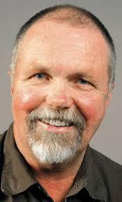 Pastor Charlie Olson preaches that old-time religion