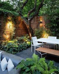 A Contemporary Townhouse Garden With Stone Tiles Minimalist Furniture Of Wood And Metal Courtyard Gardens Design Small Backyard Landscaping Townhouse Garden