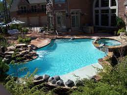 This Shotcrete Pool With Spillover Spa Waterfall And Pavers Looks Amazing In This Backyard Backyard Pool Gunite Pool Freeform Pools