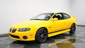 Image result for Yellow 2004 Pontiac