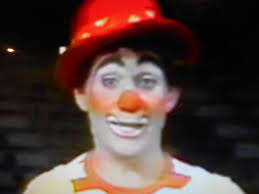 Who are the two clowns in the 1961 photograph?