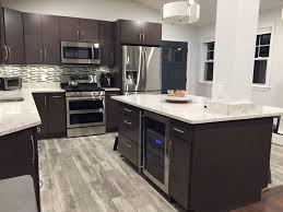 Kitchen Renovation Featuring Kraftmaid Cabinetry Barnett Slab Doors In Crafted Cherry Canyon Grey Kraf Kitchen And Bath Design Custom Kitchen Kitchen And Bath