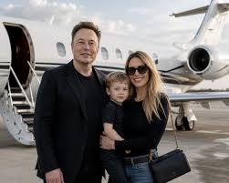 Family, jet, and the future ahead. ✈️❤️ Elon Musk standing proudly with his  partner and young son in front of their private jet on a sunny tarmac. Elon  in his signature black
