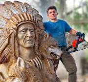 AMAZING CHAINSAW wood carving, Native American with wolves
