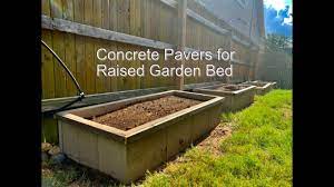 It prevents the grass from growing under the pavers and up inside the garden. Concrete Pavers For Raised Garden Bed Youtube