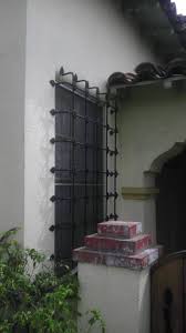 Rustica house designs are carbon copies of existing forged iron grills and rustic window boxes installed for safety as well as decorative reasons on hacienda houses of colonial mexico since spanish conquest. Spanish Style Window Bars 2a Window Bars Spanish Style Front Doors With Windows