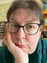 Hi, new dull member here. Photo of me and my feline companion Domino, who  is sitting