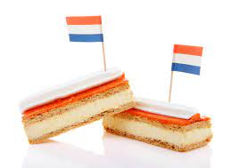 Tompouce is a traditional dutch pastry consisting of a thin puff pastry that is filled with cream and topped with a layer of smooth, pink icing. Oranje Tompouce Orange Cream Slice Dutch Community