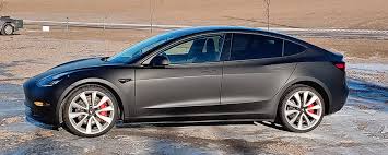 Among the model 3's unveiled is a matte black model 3 which leads us to the question: Matte Black Car Wrap Transforms Tesla Hs Sign Shop