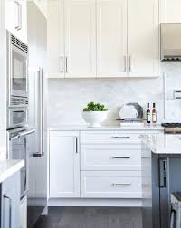 White Shaker Cabinets I Like The Pulls Too Minimalist Kitchen Cabinets Modern White Kitchen Cabinets Antique White Kitchen