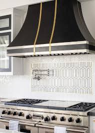 Add a cool focal point above your range by creating a piece of art with your tiles or using a different material behind your range or sink versus the rest of the kitchen. Accent Tile Above Stove Design Ideas