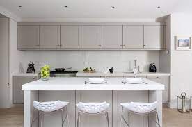 A stylish kitchen in white with a victorian feel and a navy ktichen island, skylights and pendant lamps highlight. French Grey Kitchens By Woodale Designs Shaker Style Kitchen Cabinets Kitchen Cabinet Styles Kitchen Design Modern White