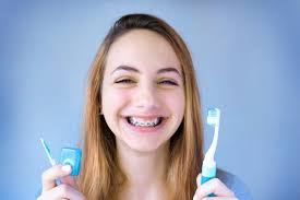 Read our quick guide to learn how to brush your teeth with braces so you can keep your braces clean and looking good. How To Brush Teeth W Braces The Best Braces Cleaning Tools