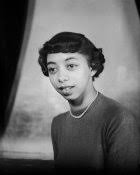 Daisy Curry, holding protest sign "Do your children live like this in  Squirrel Hill? We are still human not animals," 1963 by Charles "Teenie"  Harris