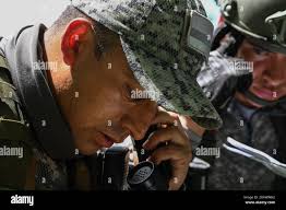 T1 Dennis Celis, a Colombian Air Force Aerial Special Operations Group  (GROEA) air and terminal attack controllers uses a pocket laser rangefinder  during the Relampago VI Exercise near Palenquero Air Base, Colombia, July  13, 2021. U.S. Air Force ...
