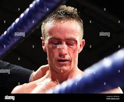 Ryan Walsh (black shorts) defeats Jerry O'Hara in a Featherweight boxing  contest at York Hall, promoted by Frank Warren Stock Photo