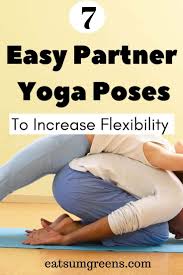 Partner a sits with legs crossed and brings hands behind hips opening up the heart. How To Improve Your Flexibility With Easy Yoga Poses For Two People Eatsumgreens