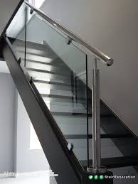 An Open Tread Black Oak Staircase With Steel Rail Glass Balustrade Glass Risers Add To The Feeling Staircase Design Glass Stairs Design Black Stair Railing