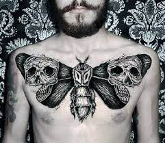 Skulls Moth Wings Mens Upper Chest Tattoos Tattoos Tattoos For Guys Moth Tattoos