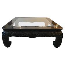 Crafted from solid wood in a distressed finish with brass and copper accents, it adds charm to your space while allowing you to prop up your feet or stash away clutter. Large Square Asian Style Hand Carved Coffee Table For Sale At 1stdibs