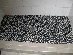 Install a river rock or pebble floor to give your shower stall the look and feel of natural stone. Painful River Rock Shower Solutions Ceramic Tile Advice Forums John Bridge Ceramic Tile