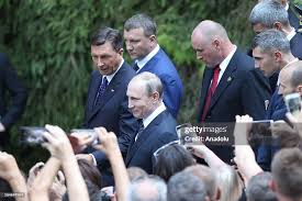 Russian President Vladimir Putin and ...