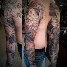 Back then, the artist that completed the final design (from dallas) he had a recommendation for an artist (is that the right term for the one actually doing the tattoo?) in dallas. Black And White Koi Sleeve By Tattoo Artist Terry Ribera