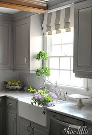 The shades stay in keeping with the white color scheme, but soften the exposed shelves and beautifully filter in the natural light from the window above the sink. Modern Kitchen Window Ideas Pinterest Are So Diverse Nowadays You D Want To Make Holes In Modern Kitchen Window Kitchen Window Coverings Kitchen Window Blinds