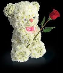 He wears a long, red tie, a shirt collar and cuffs, and nothing else. Cute Teddy Bears Dolls And Toys Made From Flowers Amazing Creativity Virtual University Of Pak Animal Flower Arrangements Flower Designs Flower Sculptures