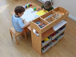 This kid's wooden art table comes with two chairs. Kid S Art Tables Children S Furniture