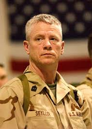 U.S. Marine Reservist Master Gunnery Sgt. Steve Seyller awaits final  instructions before the go-ahead to board a charted flight bound for the  Central Command area of responsibility (AOR) in the Arabian Gulf
