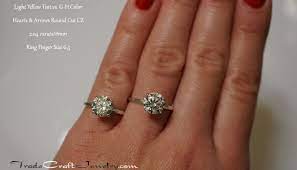 Light Yellow Tint Vs G H Near Colorless Cz Comparison Hearts Arrows Round Bril Engagement Ring On Hand Cz Rings Engagement Cubic Zirconia Engagement Rings