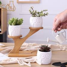 Wooden movable plant flower pot stand with wheels for outdoor home garden wood plant ceramic succulent pots with iron stand holder mini cactus pot indoor decoration modern wooden sturdy outdoor plant stand shelf strong flower pot trays wood planter adjustable. China Owl Shape White Ceramic Plant Pot With Treetop Wooden Stand China Plant Pot And Ceramic Plant Pot Price