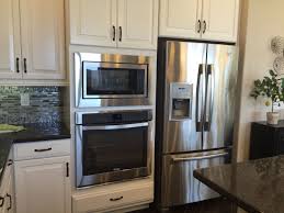 New Homes Kitchen Decor White Cabinets Stainless Steel Appliances Double Oven Next To Refrigerator Wall Oven Oven Cabinet Wall Oven Kitchen