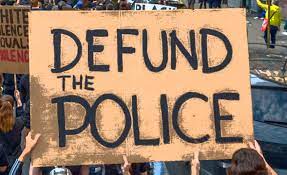 What does it really mean to 'defund the police?' - Behind the Badge