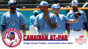 bisons to accept canadian money at par for purchase of