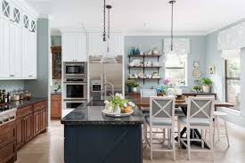 Stained wood cabinets have unique patterns and wood grains, so every kitchen will look a little different, even if the cabinet materials are the same. Want A Bigger Brighter Kitchen Get The Two Toned Look Designed
