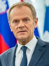 Donald tusk makes what appears to be 'gun' gesture at trump's back. Donald Tusk Center For European Studies At Harvard University