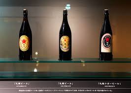 On a luxurious golden background, sapporo's star symbol of pioneering spirit is prominently printed, representing high quality. 5 Things You Might Not Know About Sapporo Beer