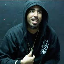 Gangster with mustache in a business suit sits in a chair and looks away. Rest Up Gangsta By Polo239