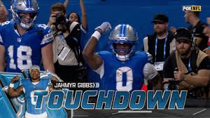 Jahmyr Gibbs scoring a 17-yard touchdown for the Detroit Lions against the New York Jets
