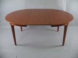 Dining Room Glossy Varnished Teak Dining Table Above Concrete Floor With Large Plastic Carp Teak Dining Table Danish Modern Dining Table Danish Teak Furniture