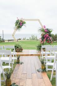 Wedding arch decorated with flowers on tropical sand beach, outd. 25 Bold Tropical Wedding Arches And Altars Weddingomania