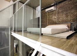 glass wood bare bricks and a fluffy white mattress interior design minimalist bed minimalist home