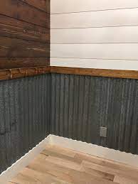 The metal siding on this building is sierra. Old Galvanized Metal Used As A Half Wall Metal Diy Industrial Bathroom Decor House Basement Remodeling
