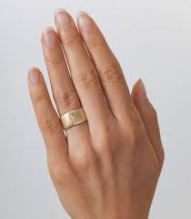 For couples who want to go the classic gold wedding ring designs mounted with tiny diamonds are a sight to behold and a joy to wear. The Chunky Gold Rings You Didn T Know You Needed For Summer In 2020 Gold Diamond Wedding Band Gold Rings Engagement Rings Sapphire